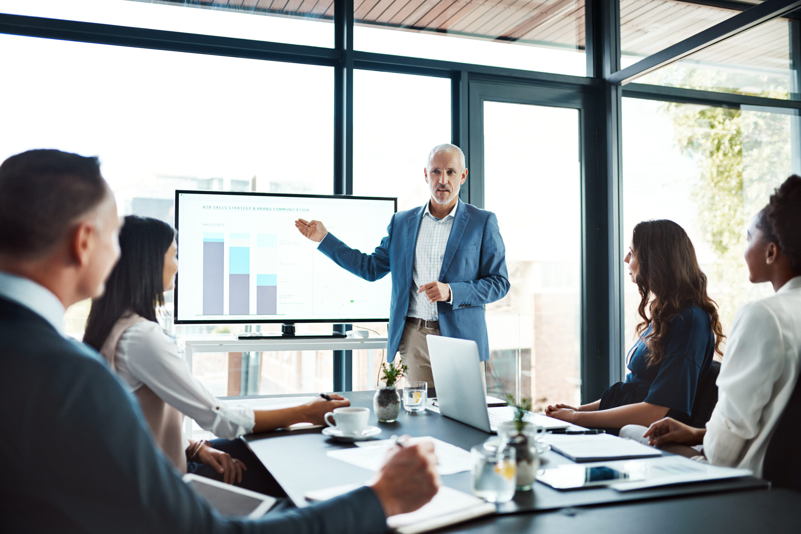 Diverse group in a business meeting looking at data
